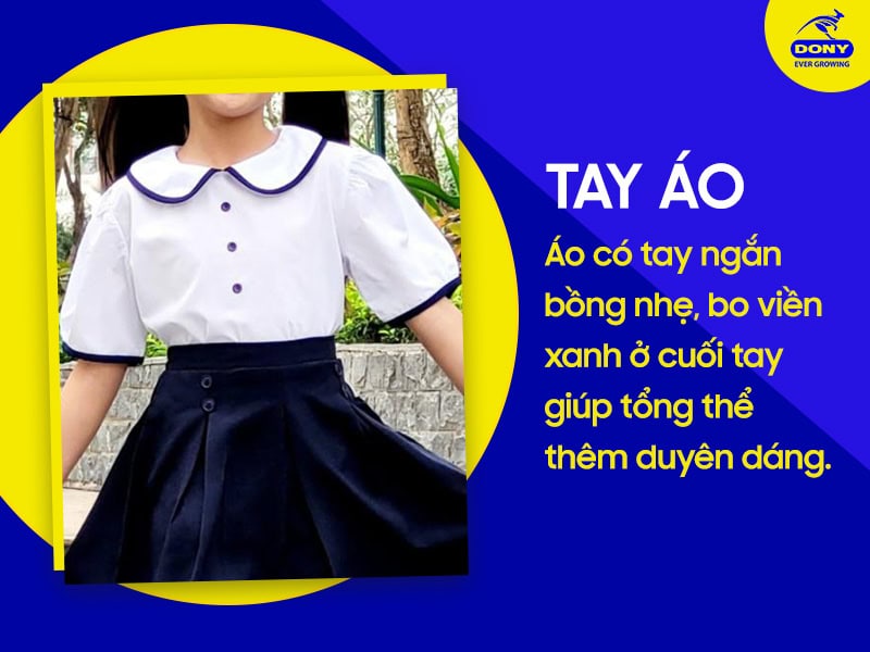 Tay áo ngắn bồng nhẹ, bo viền xanh ở tay.
