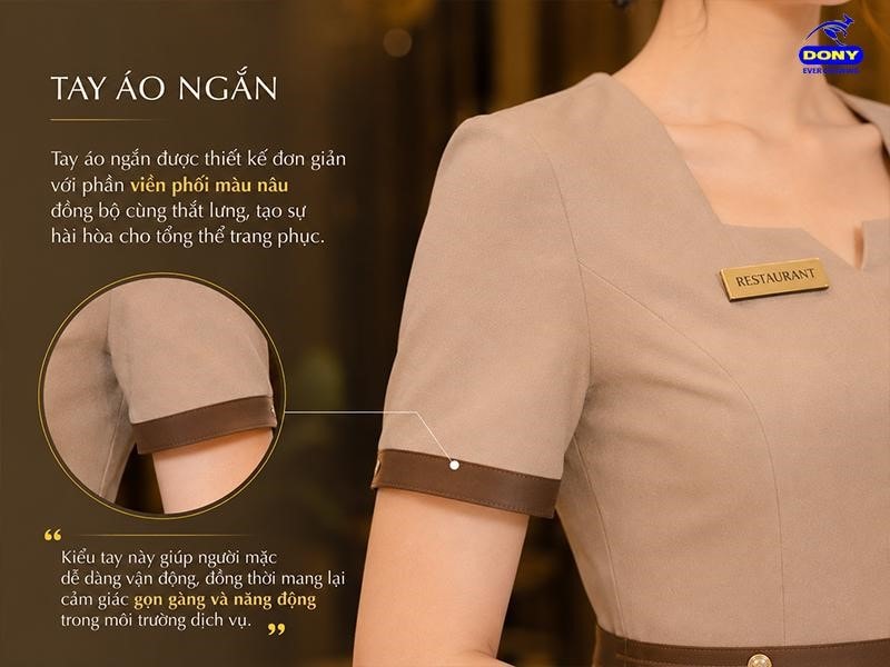 Tay áo ngắn được thiết kế đơn giản với phần viền phối màu đồng bộ cùng thắt lưng